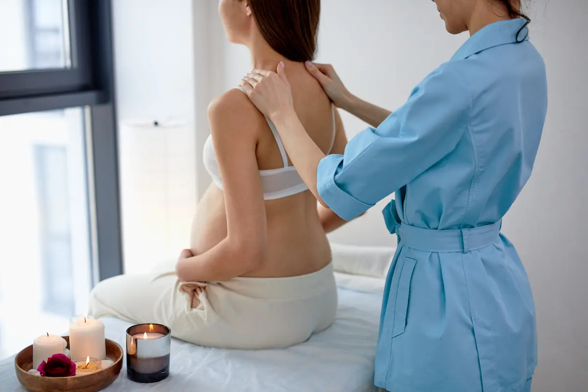 Woman getting relaxing back massage therapy session